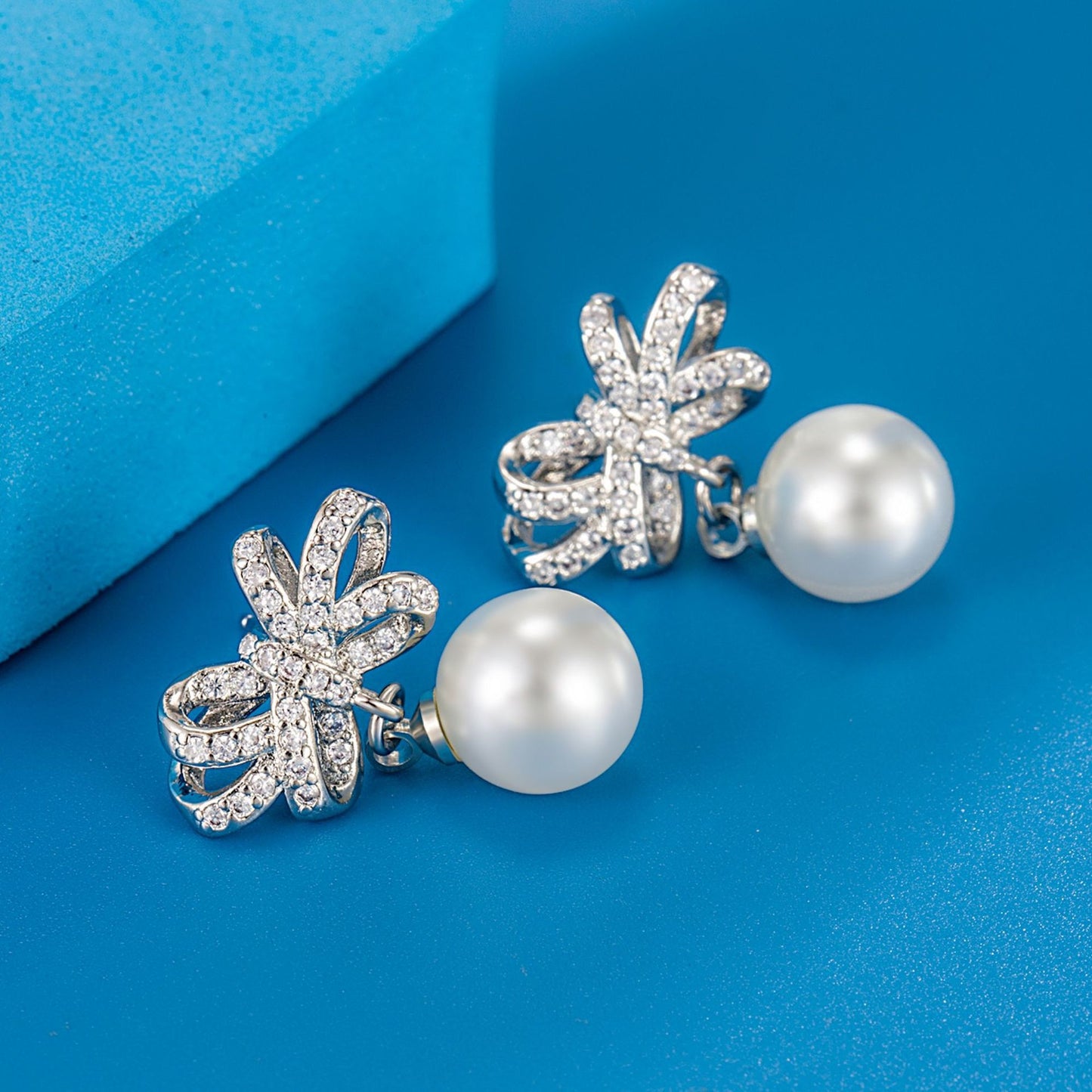 Full Diamond Bow White Pearl Ear Rings