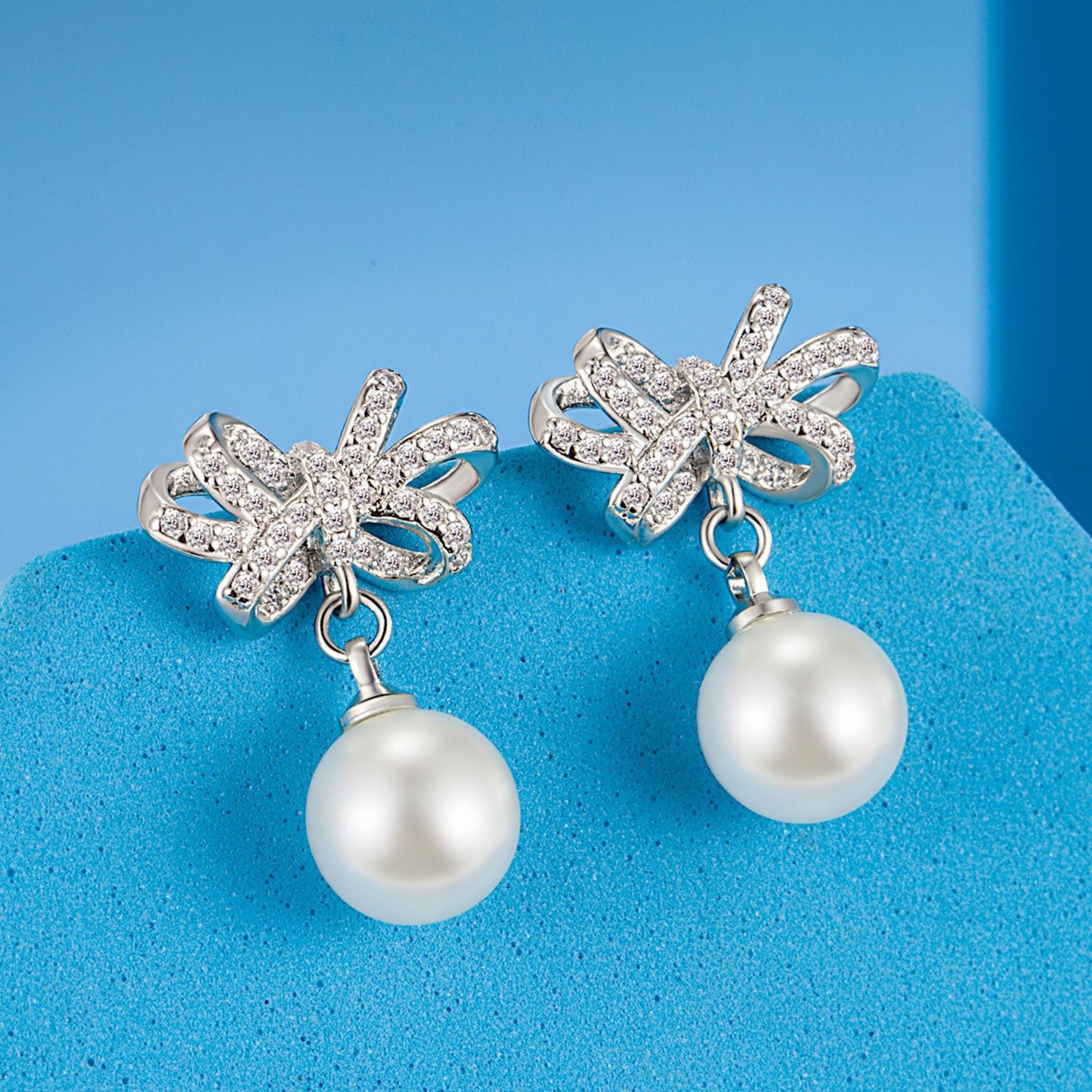 Full Diamond Bow White Pearl Ear Rings